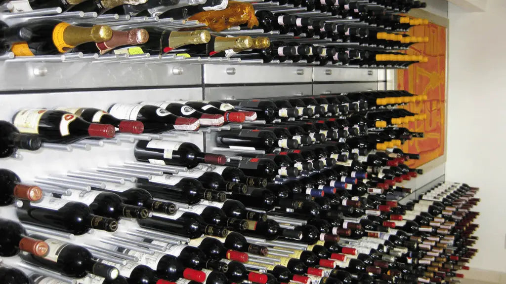 Modern wall-mounted wine rack system filled with a variety of red, white, and sparkling wine bottles, organized horizontally in a contemporary storage display.