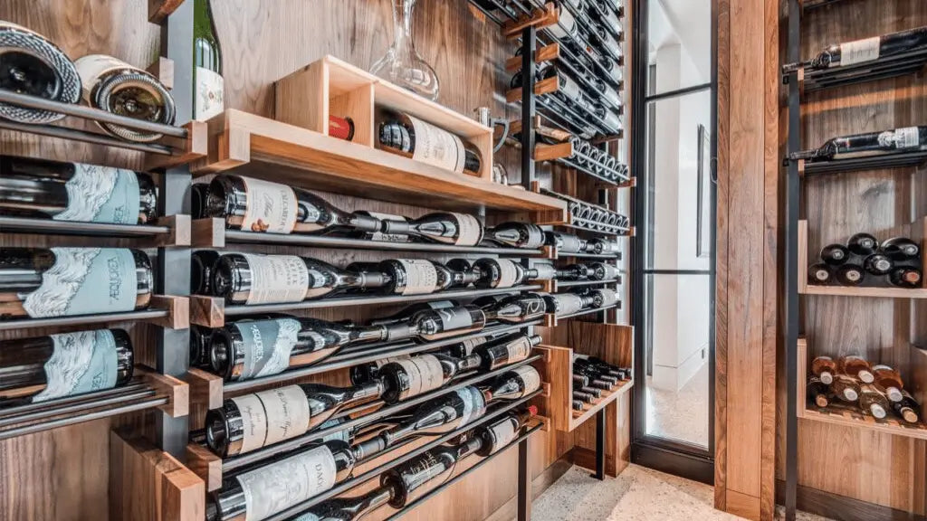 Modern wine cellar with custom wooden and metal racks for horizontal bottle storage | Wine Guardian Dealer